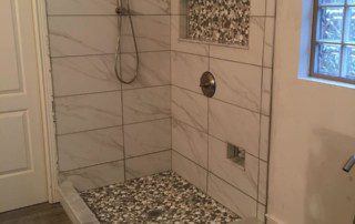 marble tiled shower enclosure