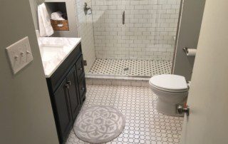 Bathroom with tile floor and tile shower enclosure
