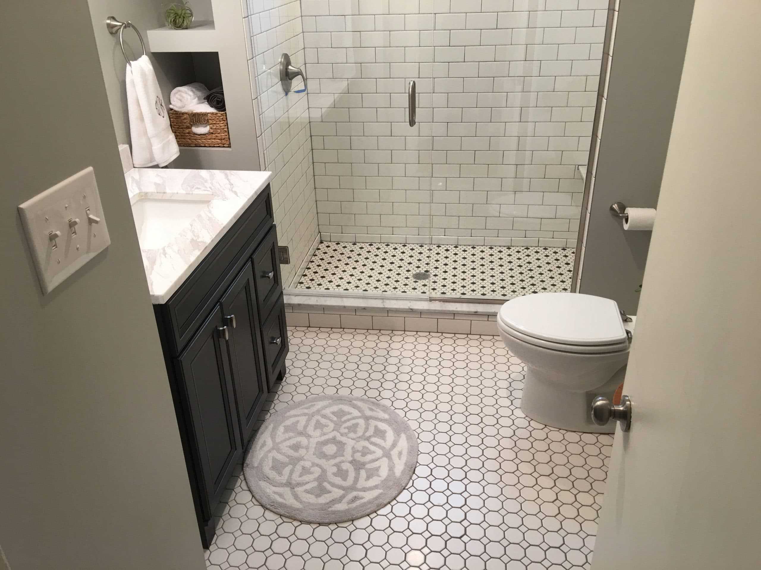 Bathroom with tile floor and tile shower enclosure